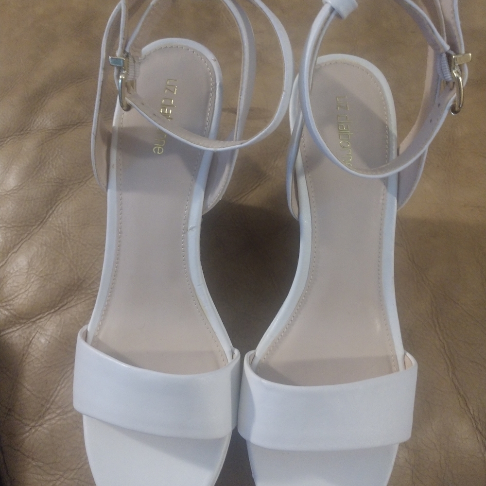 Shoes. Small scuff on top of left front shoe